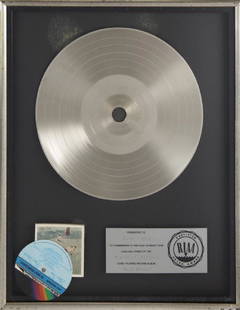 BERNIE TAUPIN ELTON JOHN BLUE MOVES "PLATINUM" RECORD: A "platinum" record award presented to songwriter Bernie Taupin to commemorate the sale of more than 1,000,000 copies of the 1976 Elton John album Blue Moves. Framed: 21 by 17 inches PROVENANCE From t