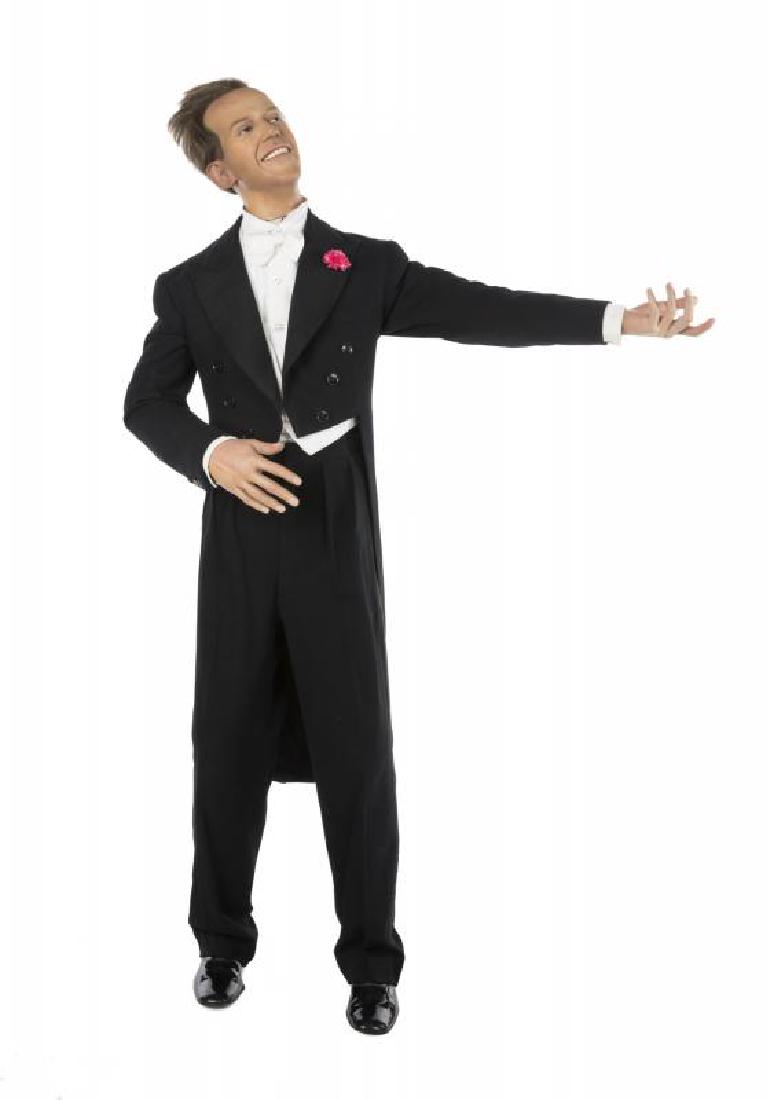 FRED ASTAIRE AND GINGER ROGERS LIFE-SIZE WAX MANNEQUINS: A pair of life-size wax mannequins of Fred Astaire and Ginger Rogers. The wax heads have hand plunged hair, glass eyes, and plastic teeth and are mounted on custom fiberglass mannequins. Astaire is dr