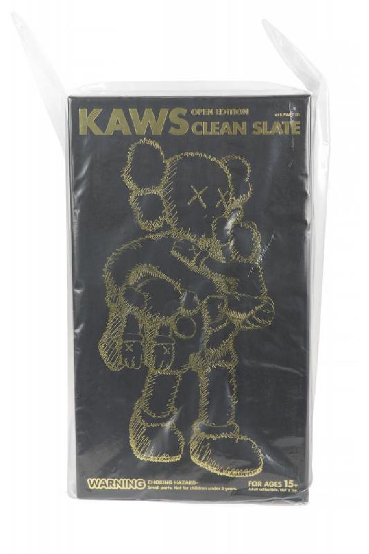 KAWS (American, 1974): Clean Slate (black) - 2018 Cast vinyl figure Sealed in original box with original shipping box included 16 1/2 by 9 1/2 by 8 1/2 inches (overall) Kaws