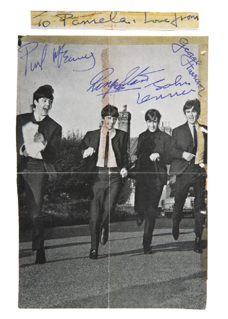 THE BEATLES SIGNED IMAGE: A page taken from the September 1963 issue of The Beatles Monthly book, signed on their image by John Lennon, George Harrison, and Ringo Starr in blue pen. Lennon has signed Paul McCartney’s autogra