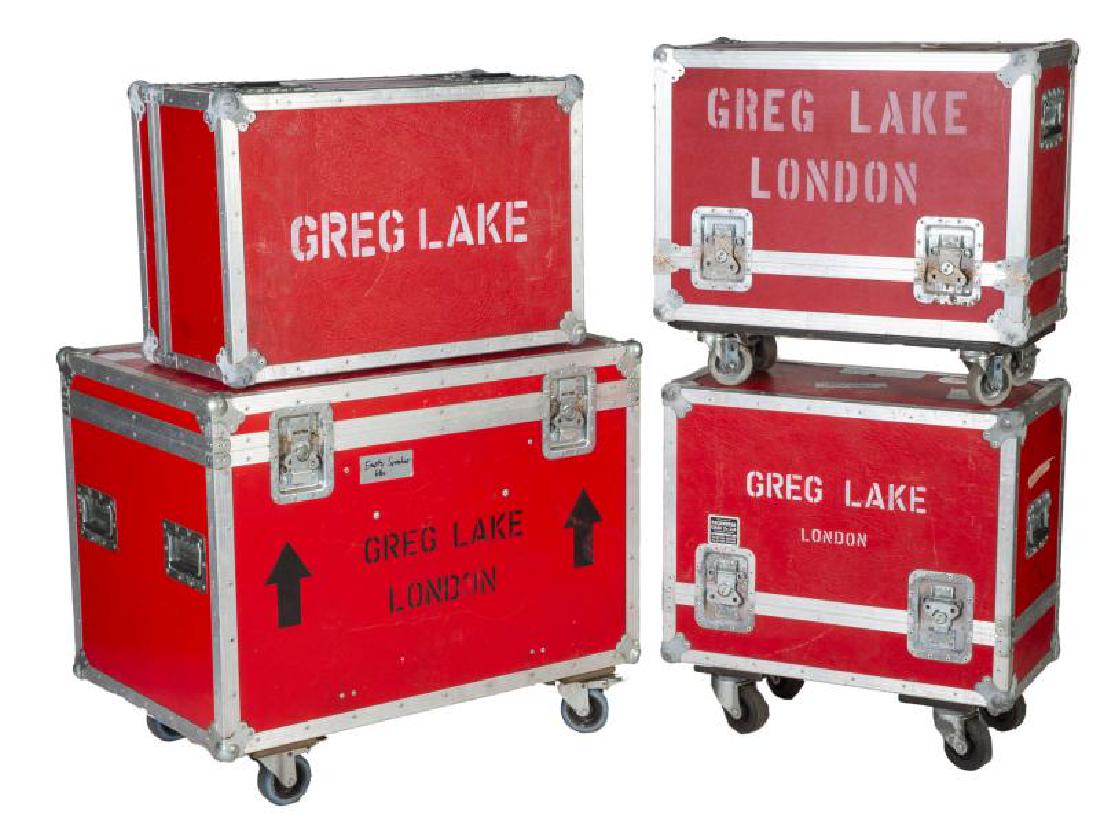GREG LAKE ROAD CASES: A group of four red road cases of various size, most stenciled with "GREG LAKE/ LONDON" or simply "GREG LAKE." Largest, 31 1/2 by 37 1/2 by 24 1/2 inches PROVENANCE From the Estate of Greg Lake Greg L