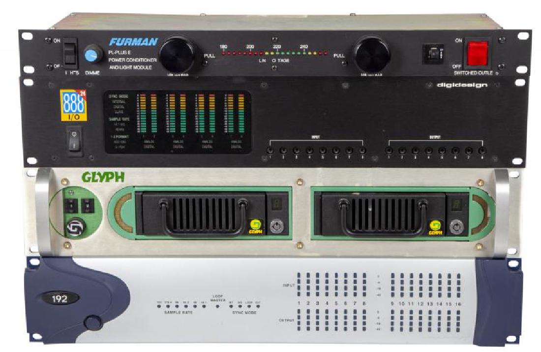 GREG LAKE STUDIO GEAR: A Glyph model R22S02 hard drive storage rack module, a Digidesign 888 interface, a Digidesign 192 I/O, and a Furman PL-Plus E power conditioner. Largest, 15 by 19 by 3 1/2 inches PROVENANCE From the E
