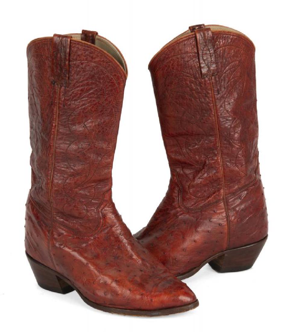 BURT REYNOLDS OSTRICH COWBOY BOOTS: A pair of oxblood ostrich leather boots by Manuel fitted with custom lift inserts. No size apparent.; PROVENANCE From the Estate of Burt Reynolds; Burt Reynolds
