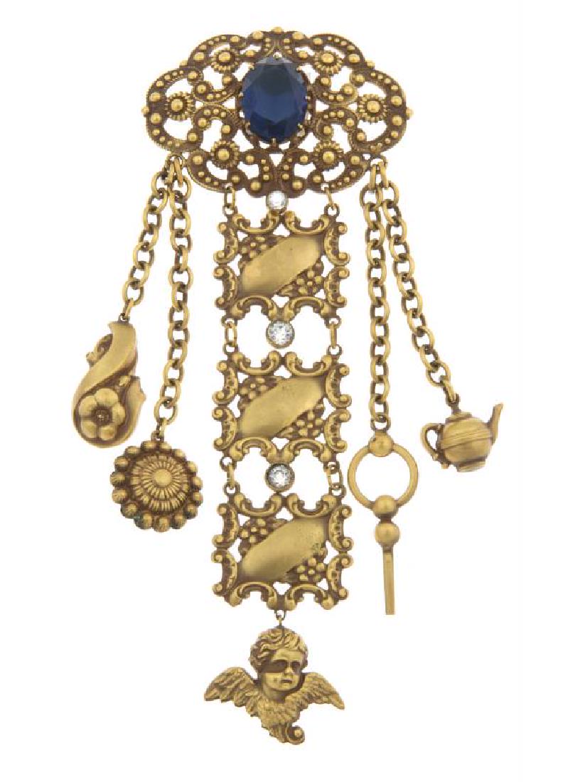 BETTY GRABLE AND OTHERS WORN CHATELAINES: A pair of gold-plated chatelaines, one with simulated diamond and sapphire, the other with simulated diamond and emerald. All done using Joseff's signature Russian plating technique; both with bar pin