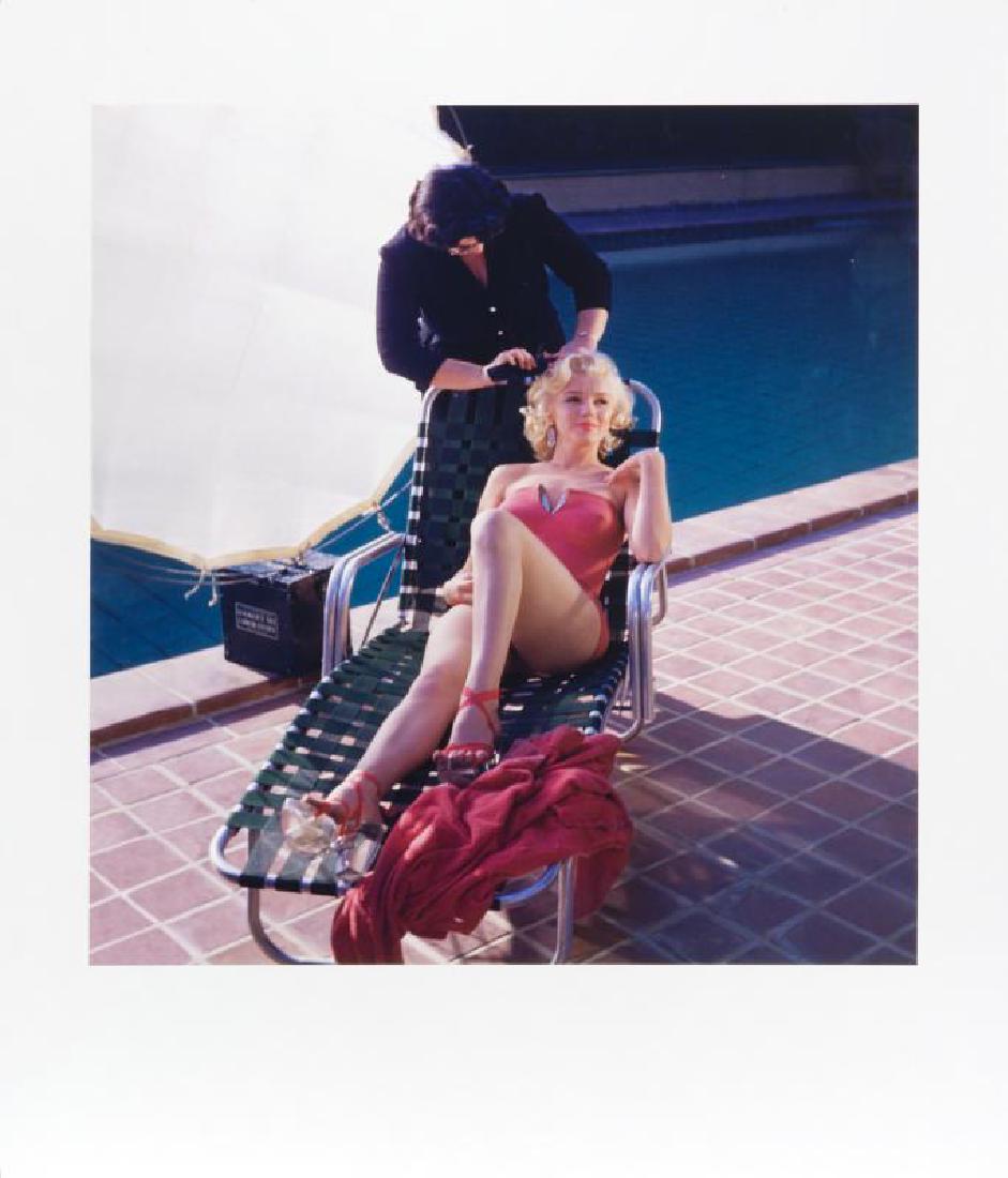 MARILYN MONROE HAROLD LLOYD PHOTOGRAPH: A large-format color photograph taken by Harold Lloyd of Marilyn Monroe lounging poolside in a pink coral swimsuit with rhinestone accents. Numbered 21/250 on the verso and bearing the Harold Lloyd Tr