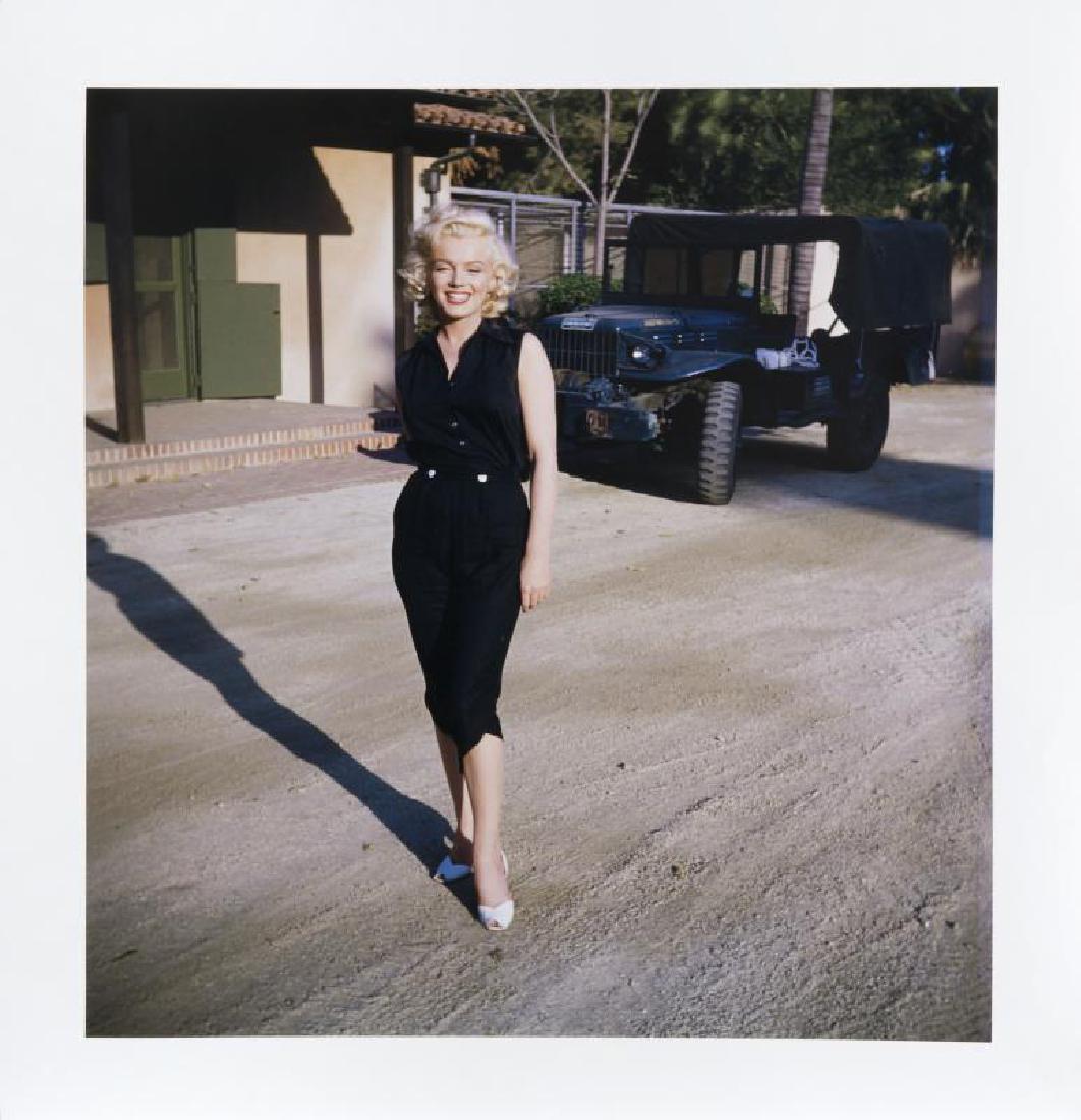 MARILYN MONROE HAROLD LLOYD PHOTOGRAPH: A large-format color photograph taken by Harold Lloyd of Marilyn Monroe standing near a Jeep. Bearing the Harold Lloyd Trust seal to the lower right corner of the recto. Unframed, 25 1/2 by 24 inches