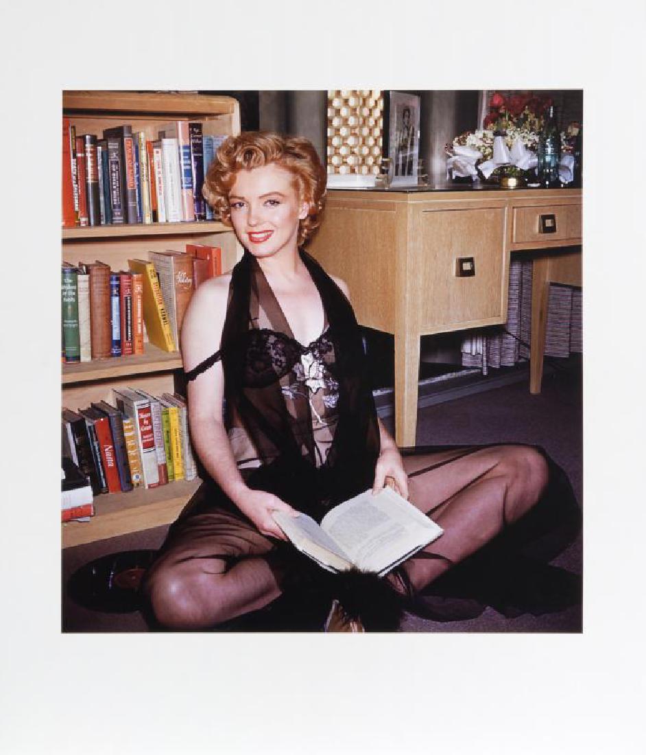 MARILYN MONROE HAROLD LLOYD PHOTOGRAPH: A large-format color photograph taken by Harold Lloyd of Marilyn Monroe reading a book in a black negligee. Numbered 22/250 on the verso and bearing the Harold Lloyd Trust seal to the lower right corn