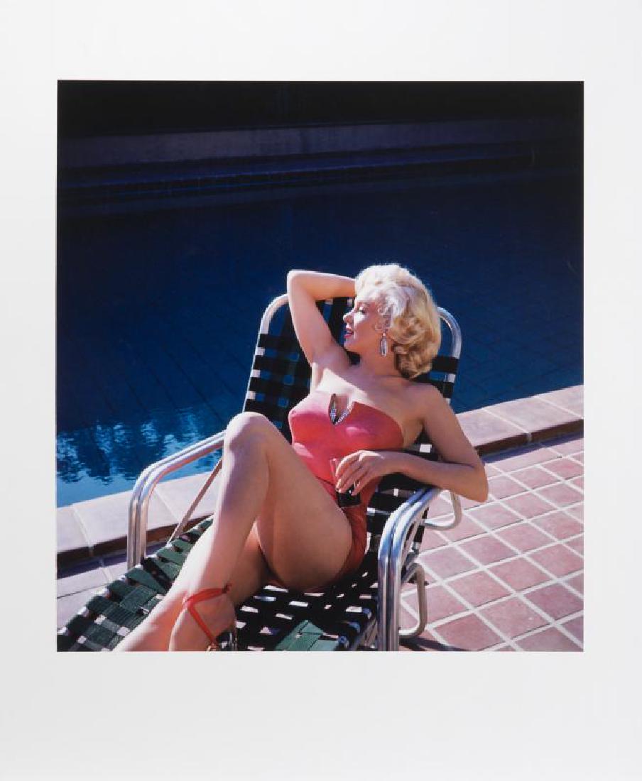 MARILYN MONROE HAROLD LLOYD PHOTOGRAPH: A large-format color photograph taken by Harold Lloyd of Marilyn Monroe lounging poolside in a pink coral swimsuit with rhinestone accents. Numbered 21/250 on the verso and bearing the Harold Lloyd Tr