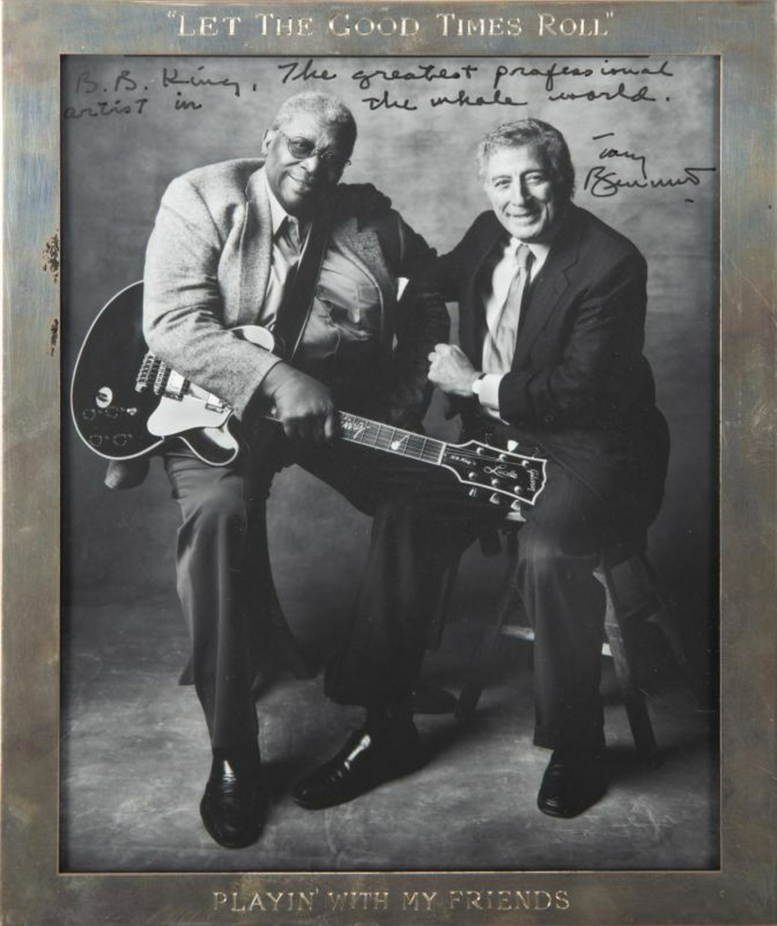 B.B. KING PHOTOGRAPH WITH TONY BENNETT: A black and white photograph of B.B. King and Tony Bennett inscribed "B.B. King, The greatest professional artist in the whole world/ Tony Bennett." The frame is engraved "Let the Good Times Roll/ Pla