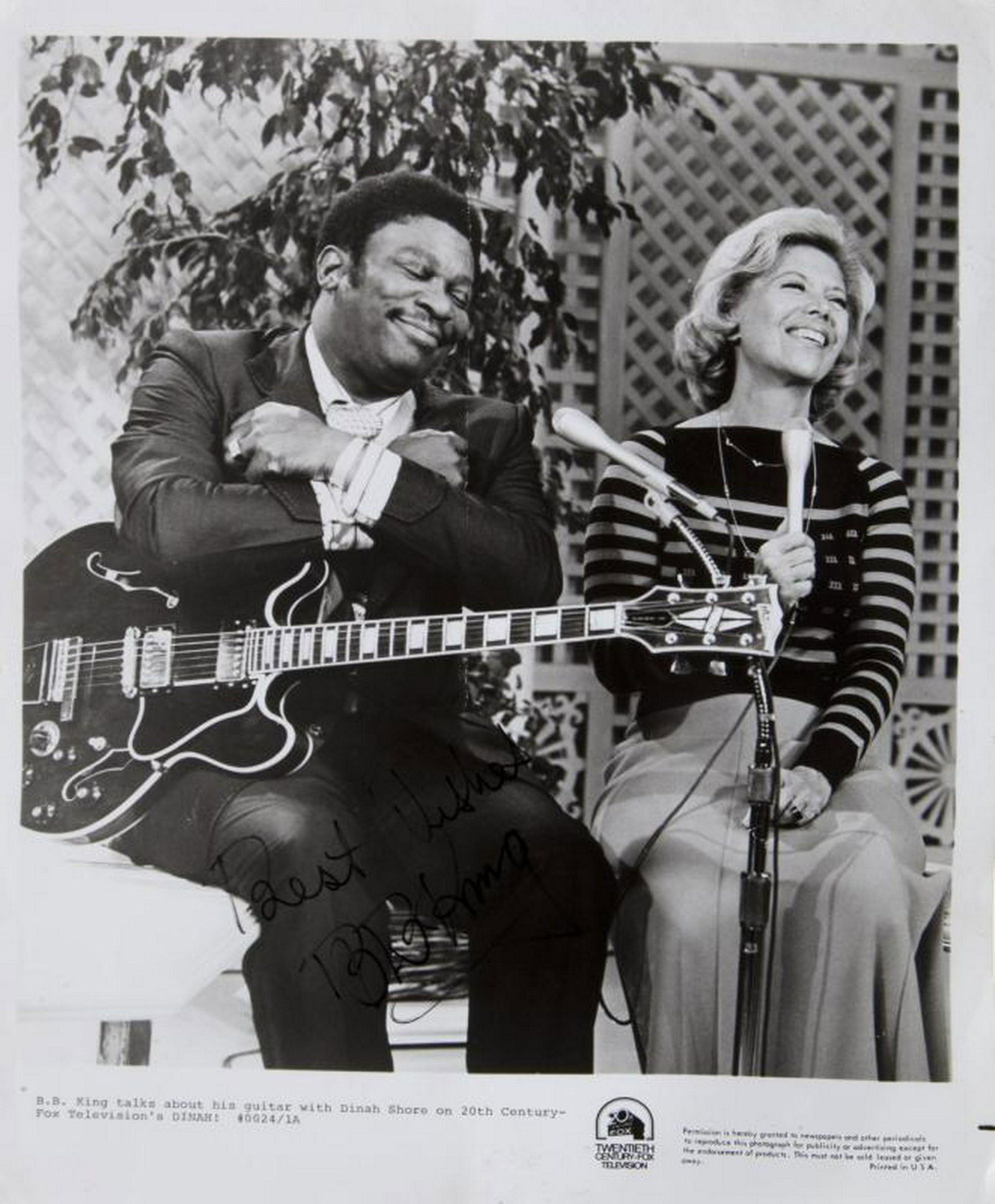 B.B. KING SIGNED PHOTOGRAPH: A black and white publicity photograph of B.B. King with Dinah Shore signed in black felt pen "Best Wishes B.B. King." 10 1/4 by 8 inches PROVENANCE From the Estate of B.B. King BB King