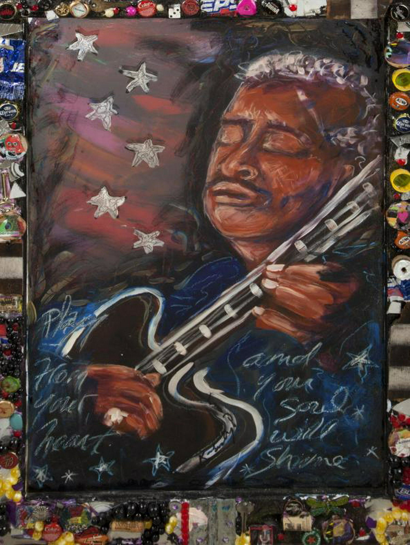 B.B. KING MIXED MEDIA PORTRAIT: A mixed media portrait of B.B. King playing Lucille, with the caption "Play from your heart and your soul will shine," housed in a frame surrounded by applied objects such as bottle caps, mirror fragm