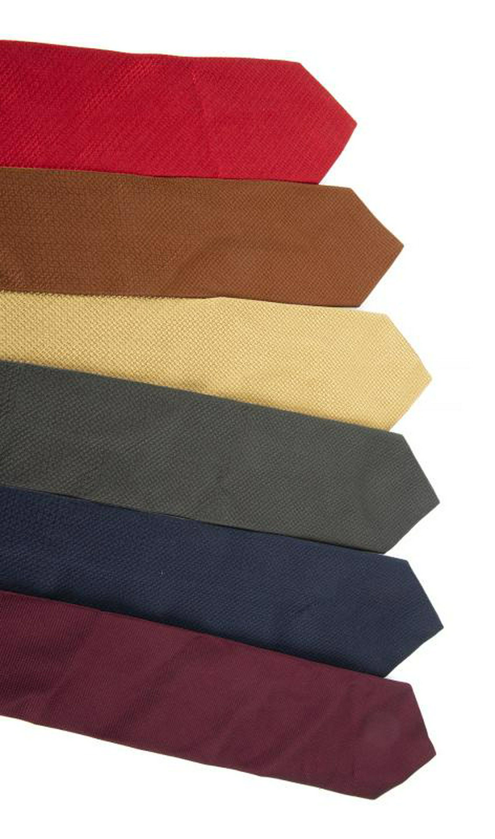 B.B. KING ERMENEGILDO ZEGNA TIES: A group of six Ermenegildo Zegna ties in navy blue, gold, red, brown, charcoal grey, and burgundy. PROVENANCE From the Estate of B.B. King BB King