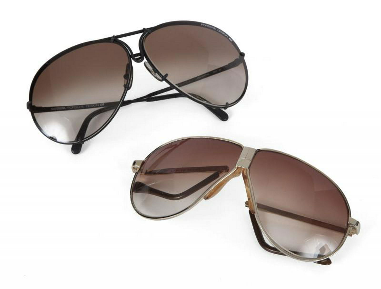 B.B. KING SUNGLASSES: Two pairs of aviator sunglasses. The first is a black pair from Carrera Porsche Design, serial number DHSD1884, with original case. The second is a foldable brown tinted pair from Caruso Design. PROVE
