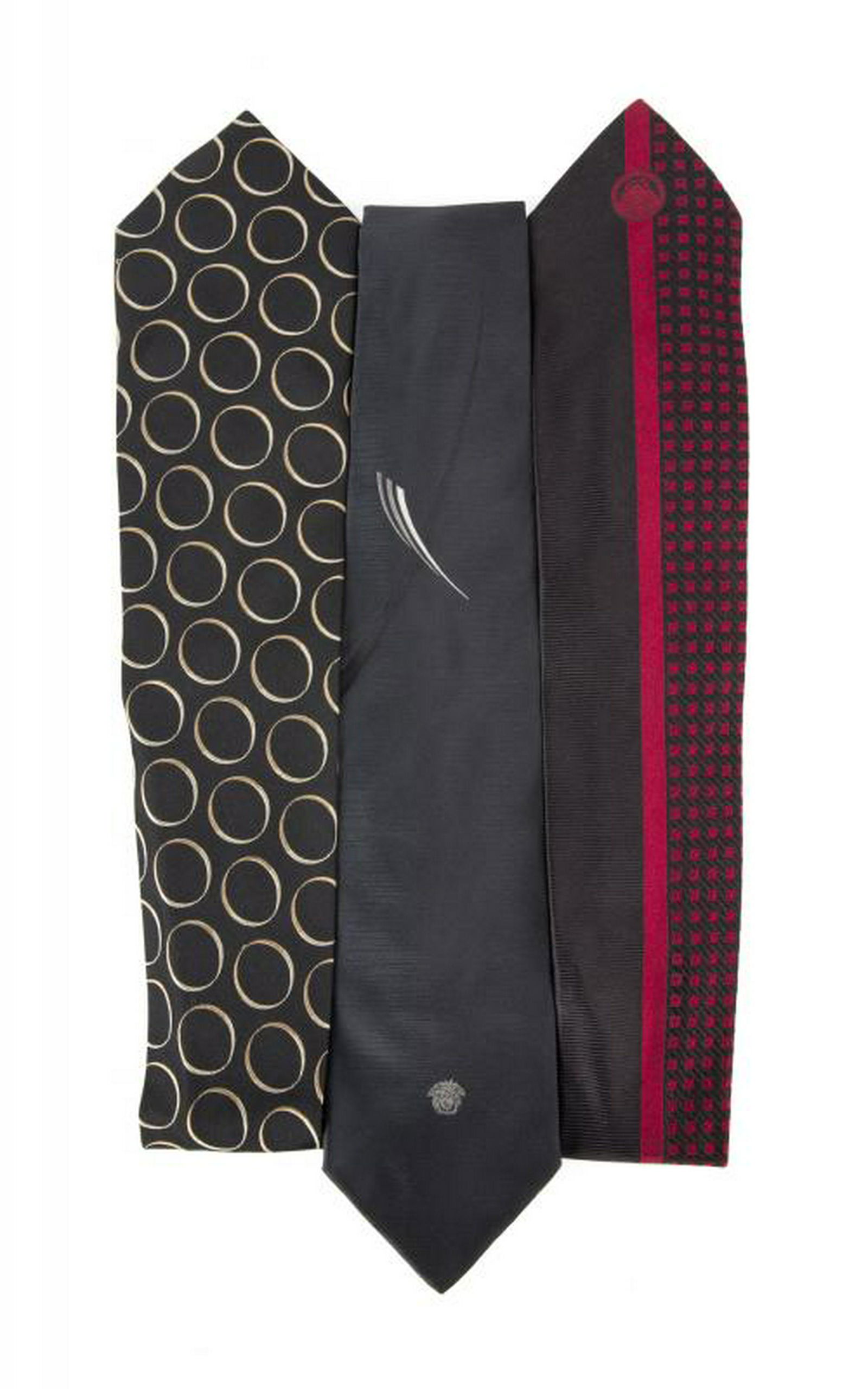 B.B. KING TIES FROM ITALIAN DESIGNERS: A group of three ties: one in black silk with gold circles by Maurizio Baldassari and two black ties by Gianni Versace. PROVENANCE From the Estate of B.B. King BB King
