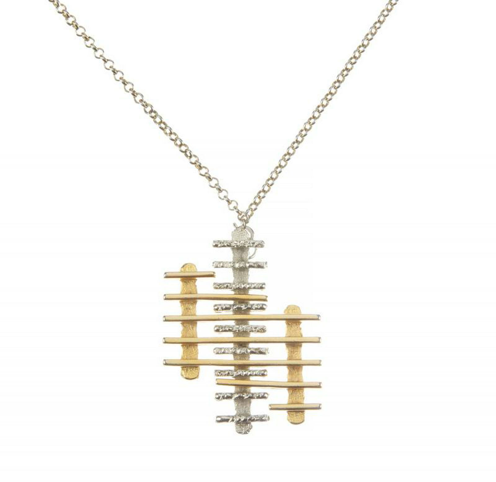 B.B. KING COSTUME GOLD AND SILVER PENDANT CHAIN: A costume gold and silver bar design pendant suspending on a long infinity chain. Length, 29 1/2 inches PROVENANCE From the Estate of B.B. King BB King