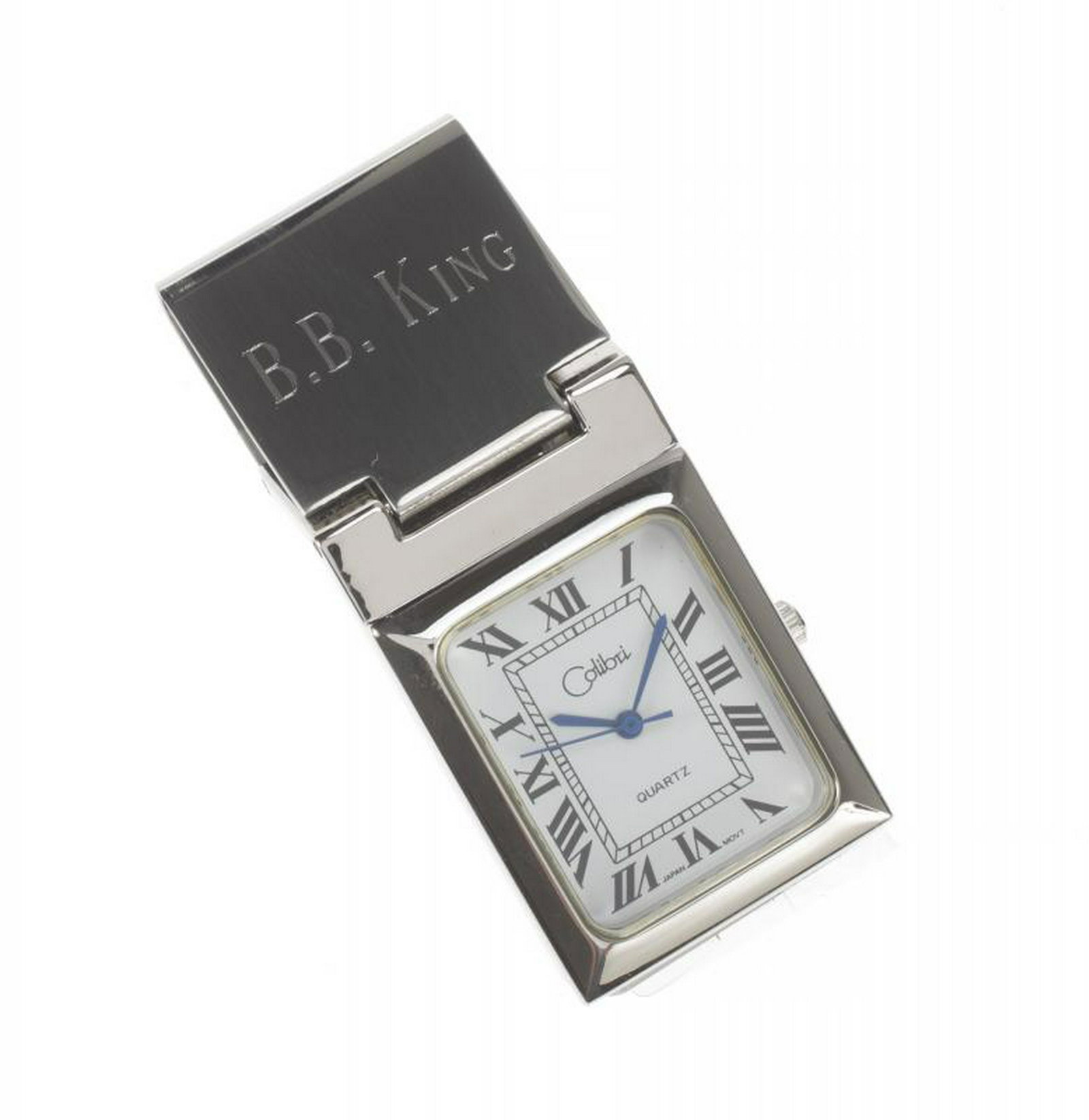 B.B. KING PERSONALIZED MONEY CLIP TIMEPIECE: A Colibri timepiece with Roman numeral chapters and blue hands attached to a money clip, with "B.B. King" engraved on the top. The item is unused and housed in the original Colibri of London box. Leng