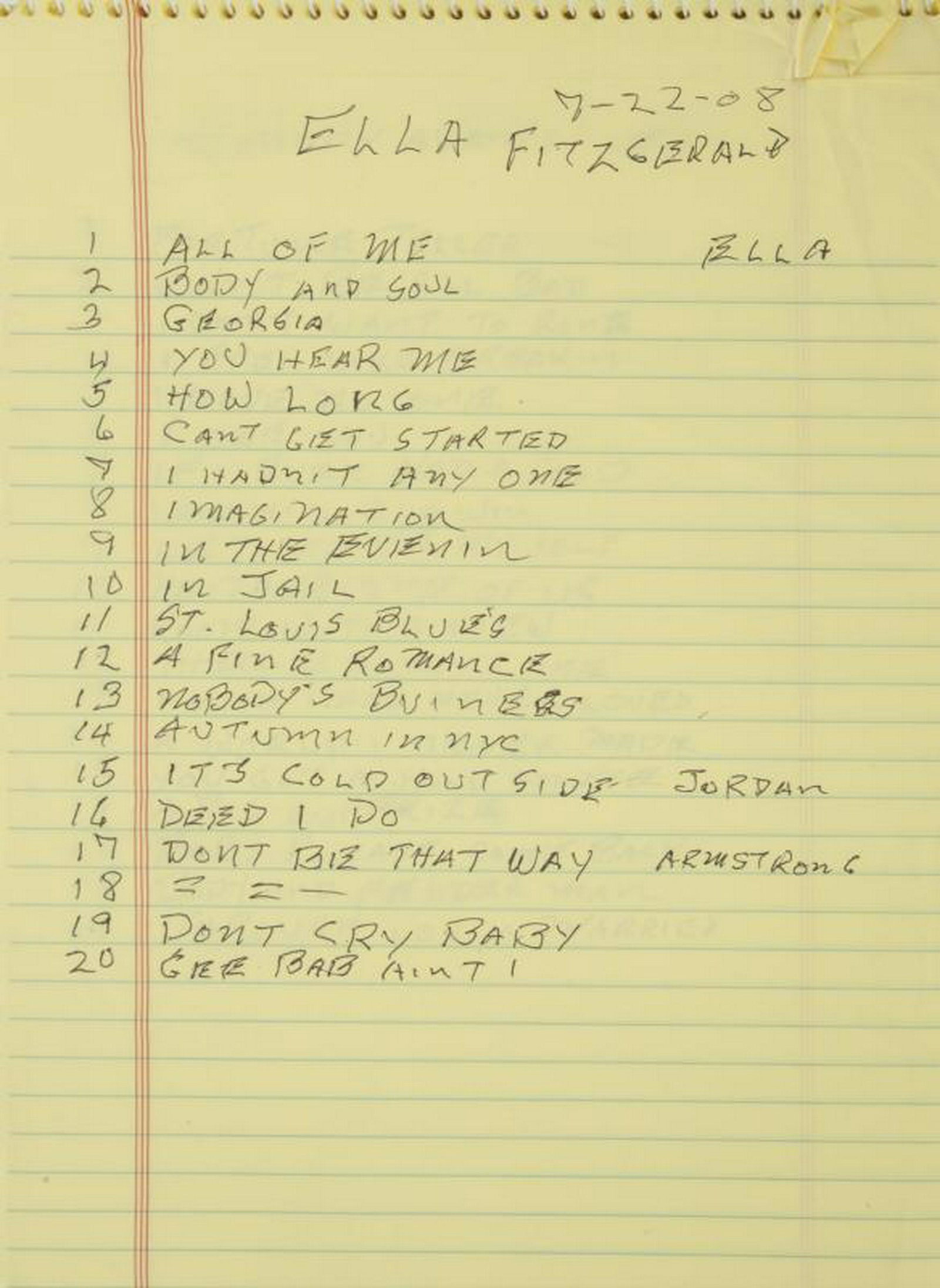B.B. KING NOTEBOOK WITH HANDWRITTEN TRACKLISTS: A spiral-bound green Docket notebook with yellow lined pages, half filled with handwritten tracklists from various singers. The first page has 20 tracks of Ella Fitzgerald songs, the next two pages ha
