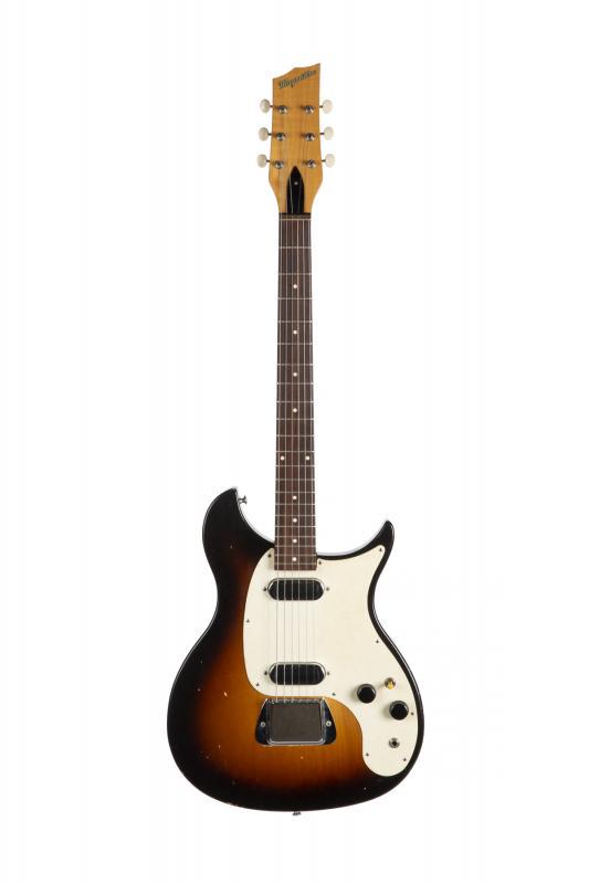 WALTER BECKER MAGNATONE MARK VIII: A Magnatone Mark VIII electric guitar circa 1959. The chambered body is finished in sunburst and equipped with a pair of single coil pickups. The neck plate is impressed with the serial number M797. A