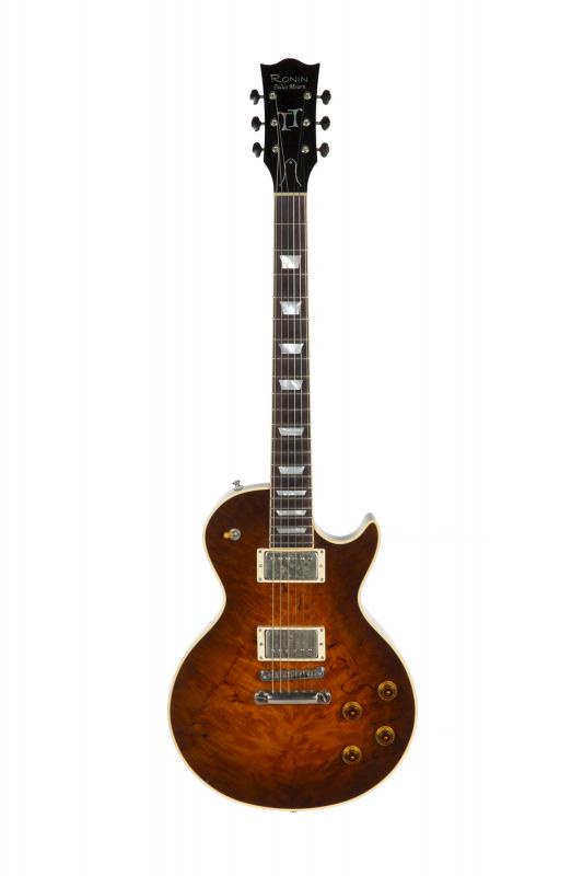 WALTER BECKER RONIN PALUS MOURN: A Ronin Palus Mourn model electric guitar. The single cutaway body constructed in redwood with white binding, a figured redwood top and contoured back. Also featuring a mahogany neck and a pair of SWD