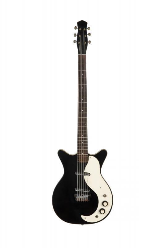 WALTER BECKER DANELECTRO SHORTHORN BARITONE GUITAR: A Danelectro double cutaway baritone electric guitar circa 1960s, finished in black with a pair of Lipstick Tube pickups. Accompanied by hard shell case. PROVENANCE From the Estate of Walter Becker Wa