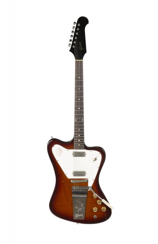 WALTER BECKER 1965 GIBSON FIREBIRD V: A non-reverse 1965 Gibson Firebird V electric guitar finished in sunburst. The guitar is fitted with Kluson strip tuners, two mini humbuckers and a vibrato tailpiece. The original selector switch has 