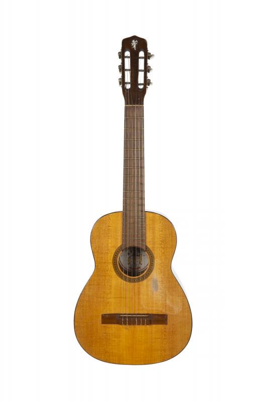 WALTER BECKER 1967 LA MADRILENA GUITAR: A small size acoustic guitar, paper label to the interior reads “Guitarras Finas/ “La Madrilena”“ and is inscribed with the date “1967” and the model “10.” Accompanied by a gig bag. PR