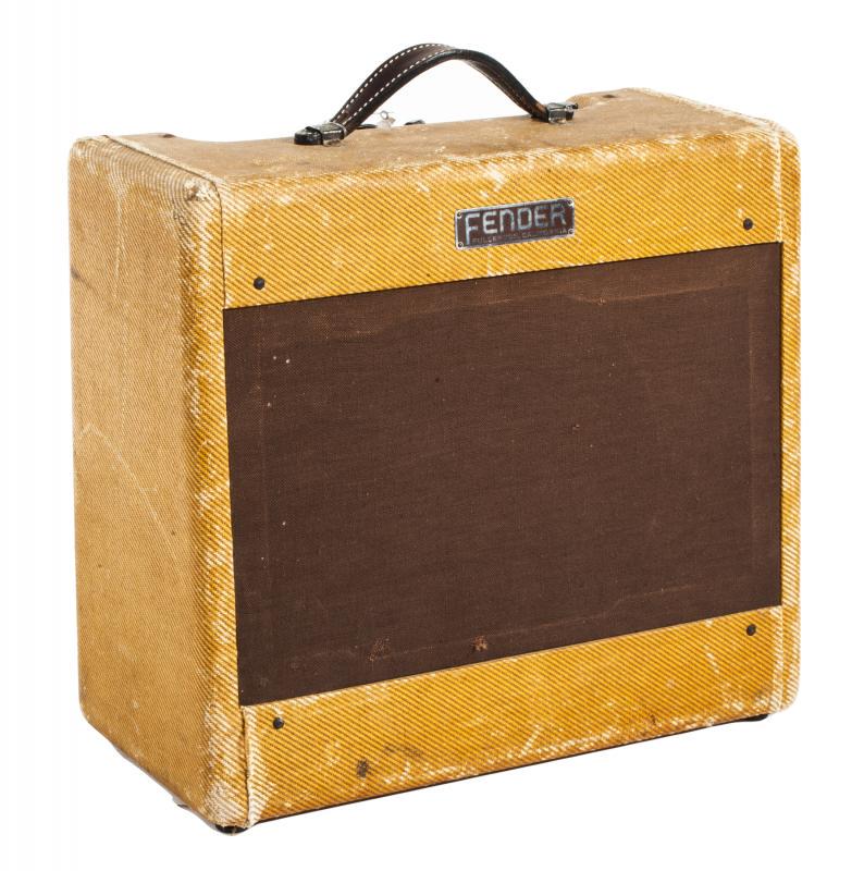 WALTER BECKER 1954 FENDER DELUXE TWEED COMBO AMPLIFIER: A 1954 Fender Deluxe 5C3 Deluxe tweed 1x12 combo amplifier. The cabinet is loaded with the original Jensen P12R, a tube chart to the interior is inscribed with the serial number 1675 and stamped with 