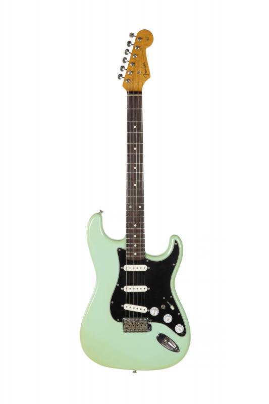 WALTER BECKER FENDER STRATOCASTER '62 REISSUE: A Japanese made Fender Stratocaster circa 1985. A reissue of the 1962 Stratocaster featuring a maple neck with slab rosewood fretboard, three-ply pickguard and a Sonic Blue finish which has yellowed i