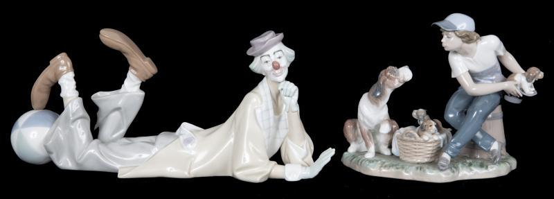 LLADRO FIGURINES: A group of two Lladro figurines: a boy and a dog with puppies," This One's Mine," #5712; and a supine clown, "Clown with Ball," #4618. Taller, height 7 inches Radio