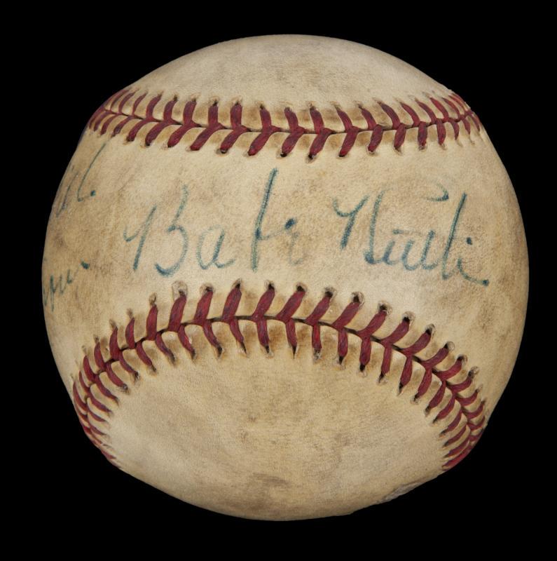 BABE RUTH SIGNED AND INSCRIBED BASEBALL: A Reach Official American League Baseball (Harridge), era 1943- 1945, signed and inscribed by Babe Ruth. Ruth has signed the ball across the sweet spot in blue ink "To Bill/ From Babe Ruth." Ruth esta