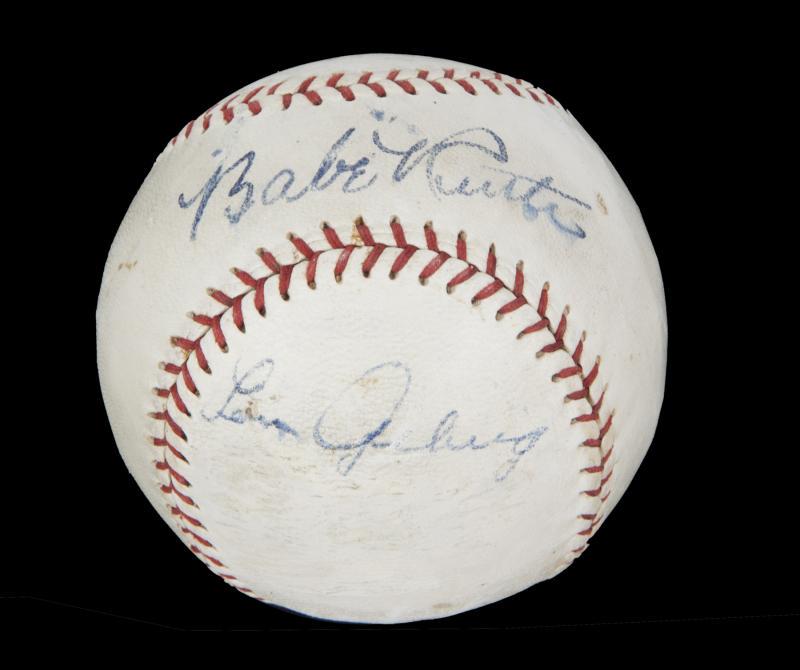 BABE RUTH AND LOU GEHRIG SIGNED BASEBALL: A Spalding Official League "King of the Diamond" Baseball signed by Babe Ruth and Lou Gehrig in blue ink. Ruth, a New York Yankee from 1920 to 1934, helped the team win seven pennants and four World S