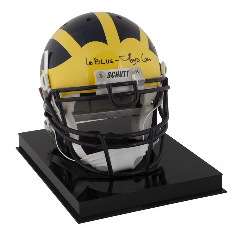 LLOYD CARR SIGNED MICHIGAN WOLVERINES HELMET: A Schutt authentic Michigan Wolverines football helmet signed by former University of Michigan coach Lloyd Carr. Carr was the head coach of the Wolverines from 1995 to 2007, leading the team to one Na