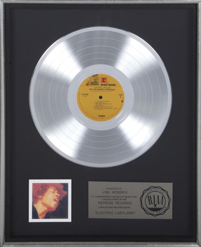 JIMI HENDRIX ELECTRIC LADYLAND "PLATINUM" RECORD AWARD: A "platinum" record award presented to Jimi Hendrix for the album Electric Ladyland . Framed, 21 1/8 by 17 1/8 inches Jimi Hendrix