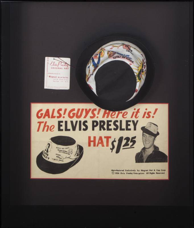 ELVIS PRESLEY 1950s HAT AND PROMOTIONAL ADVERTISEMENT: A promotional poster advertising an Elvis Presley merchandise hat framed together with an unused 1956 example of the hat bearing its original tag. Framed, 25 1/2 by 22 1/2 inches Elvis Presley