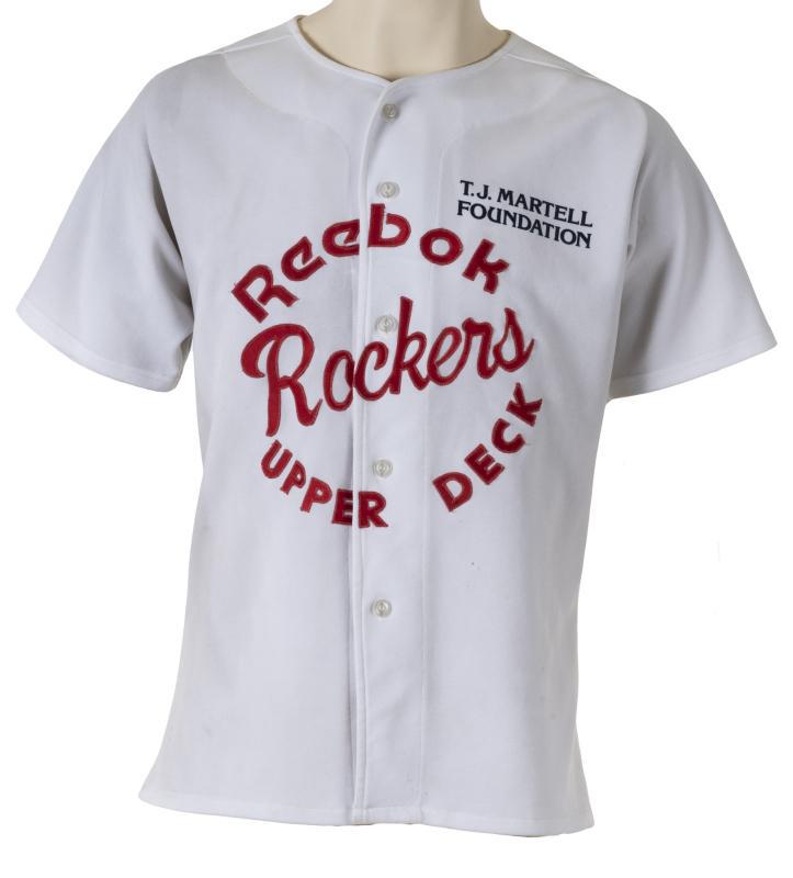 LAYNE STALEY WORN JERSEY WITH PHOTOGRAPH: A short-sleeve jersey worn by Alice In Chains lead singer Layne Staley. The button-down white jersey has "Reebok Rockers Upper Deck" in red on the front and "T.J. Martell Foundation" in black on the l