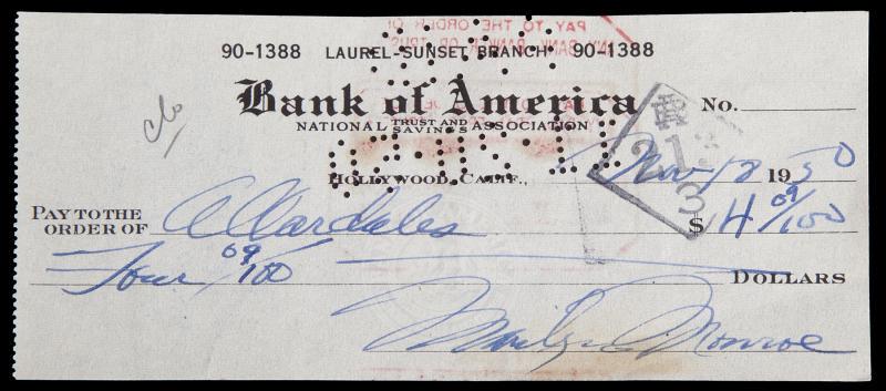 MARILYN MONROE HANDWRITTEN CHECK: A standard one penned in blue fountain pen ink by the star, dated "Nov 12, 50," written out to "Allardales" for "$4.09" and signed in the lower right corner "Marilyn Monroe," cancellation stamps and p