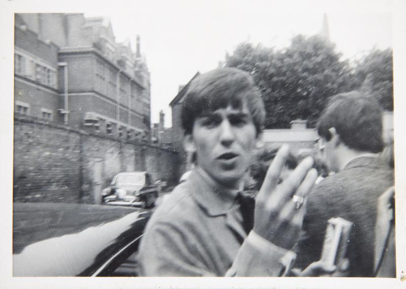 GEORGE HARRISON SIGNED AND INSCRIBED PHOTOGRAPH: Request condition report! A black and white photograph of George Harrison signed on verso in blue pen “To Dianne lots of love from George Harrison xxx.” 3 1/2 by 5 inches Rock 'N' Roll