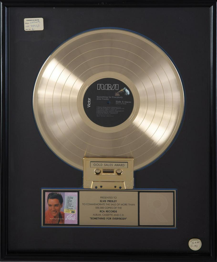 ELVIS PRESLEY "GOLD" RECORD AWARD: An RIAA-certified “gold” record award presented to Elvis Presley to commemorate the sale of more than 500,000 copies of the RCA Records album, cassette, and CD Something for Everybody. The record