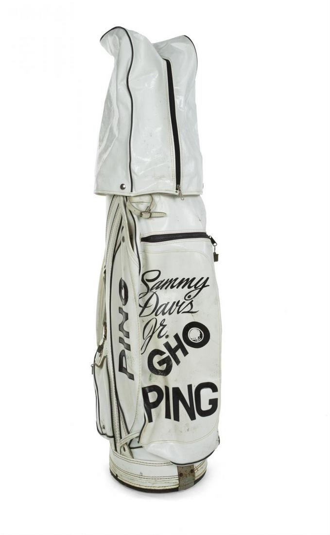 SAMMY DAVIS JR. GOLF BAG GIFTED TO MICKEY ROONEY: A white vinyl golf bag with black text on the front reading “Sammy/ Davis/ Jr.” as well as “Ping” throughout. Davis used the bag when he and Mickey Rooney played in a celebrity