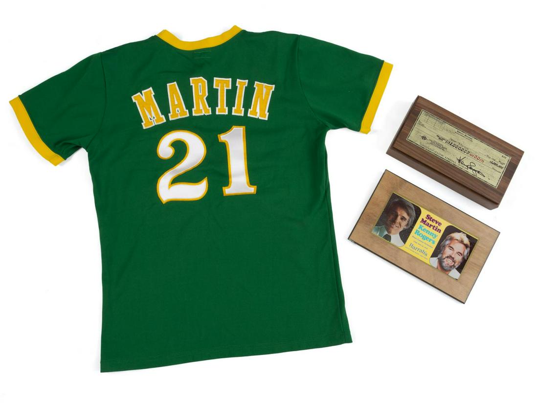 STEVE MARTIN ITEMS RELATED TO KENNY ROGERS: A group of three items: a wood trinket box with a metal replica of a 1978 check made out to Steve Martin from Kenny Rogers for one million dollars; a wood plaque from Harrah's featuring color images o