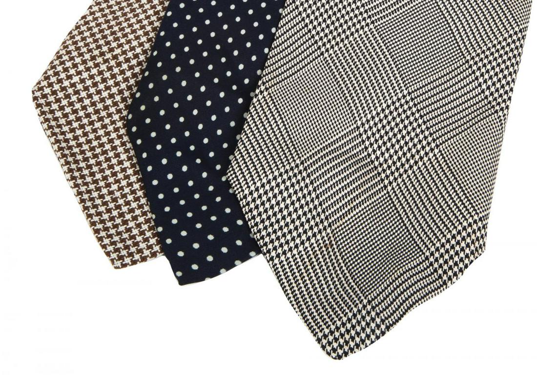 ROBERT EVANS PATTERNED TIES: Two silk ties by The Polished Gentleman, New York, together with a patterned wool tie by Fox Hill. PROVENANCE From the Estate of Robert Evans Hollywood
