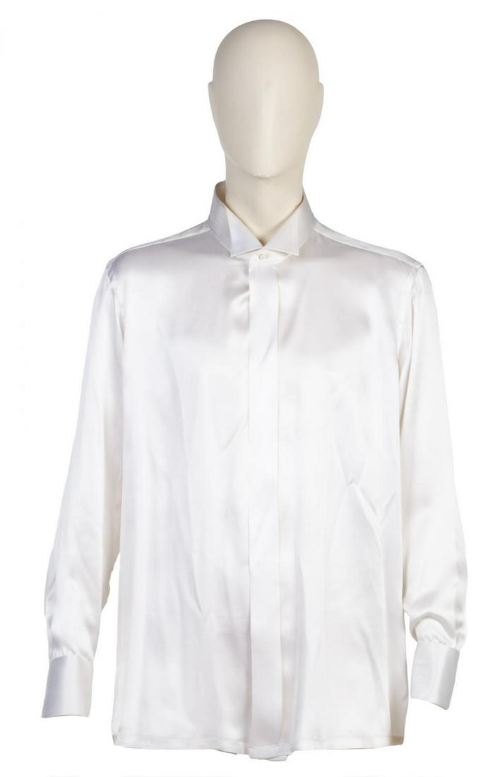 ROBERT EVANS CUSTOM ANTO BEVERLY HILLS SHIRTS: A group of three silk shirts: one champagne, one silver, and one light blue. Each has a tag reading "RE" and a date label. No size tags. PROVENANCE From the Estate of Robert Evans Hollywood