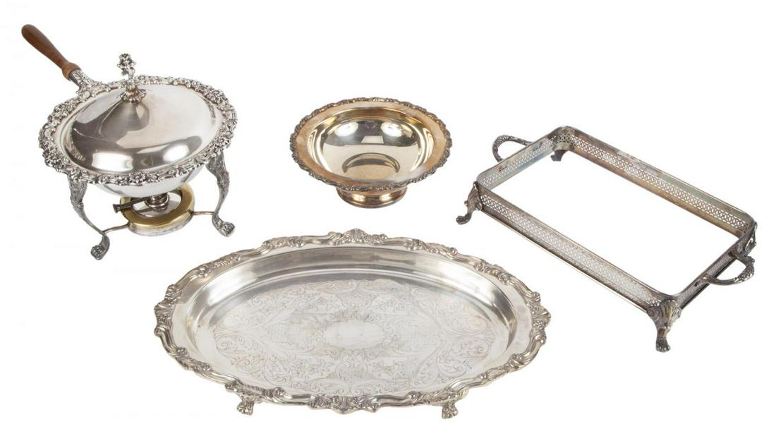 ROBERT EVANS SERVEWARE: A group of four silver plated items: a wood handled circular chafing dish, a rectangular dish holder, an oval tray, and a round bowl. By American makers such as Oneida and Rogers. Largest, 11 by 20 in