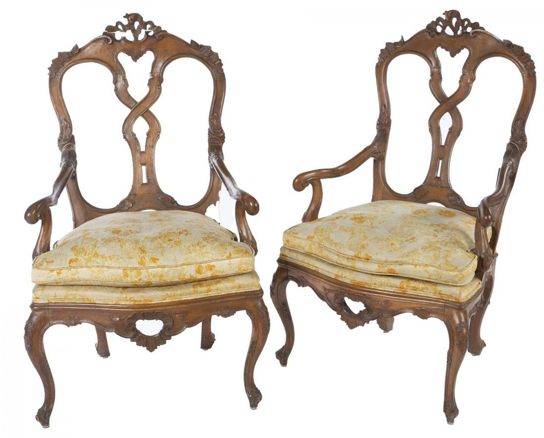 ROBERT EVANS PAIR OF VENETIAN ROCOCO CHAIRS: A pair of Late 18th/Early 19th century Venetian rococo fruitwood armchairs with upholstered seats, pierced carved back splats, shell and scroll carved aprons and crests, and cabriole legs with scrolle
