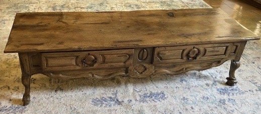 ROBERT EVANS LIVING ROOM COFFEE TABLE: A Louis XV style provincial French walnut low table with two pull-out drawers, shaped apron, and cabriole legs. From the living room at Woodland. coffee table: 20 by 77 by 24 inches PROVENANCE From th