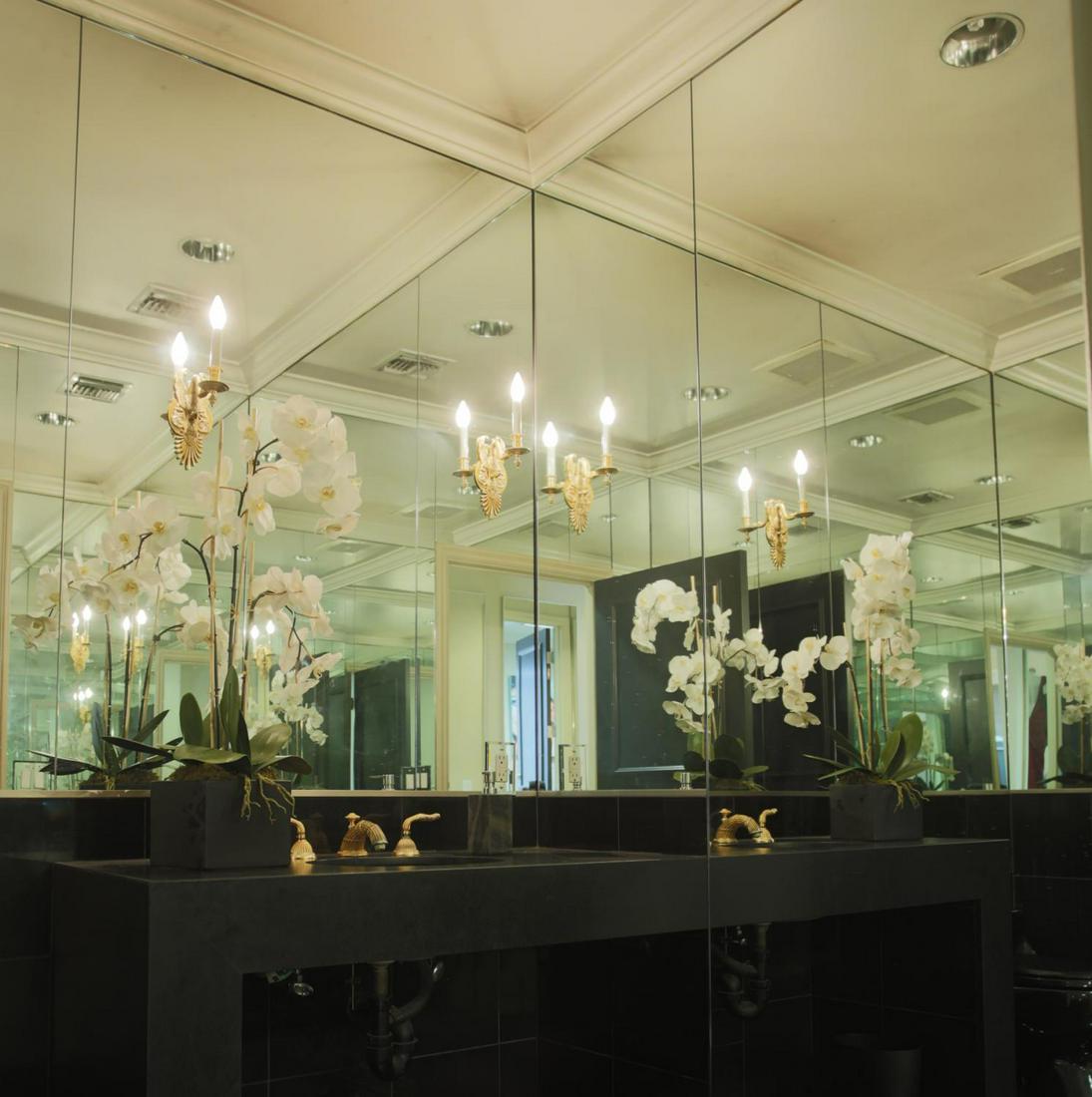 NOLAN MILLER SHERLE WAGNER WALL LIGHTS: A pair of modern gold plated wall sconces in the Imperial Swan pattern from the maker Sherle Wagner. 14 by 4 by 6 inches PROVENANCE From the Estate of Nolan Miller Hollywood