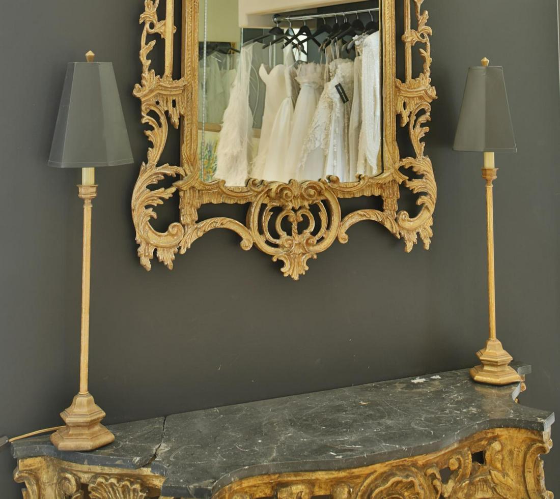 NOLAN MILLER PAIR OF TABLE LAMPS: A pair of vintage table lamps with carved giltwood bases and black hexagonal paper shades. Height, 32 inches PROVENANCE From the Estate of Nolan Miller Hollywood