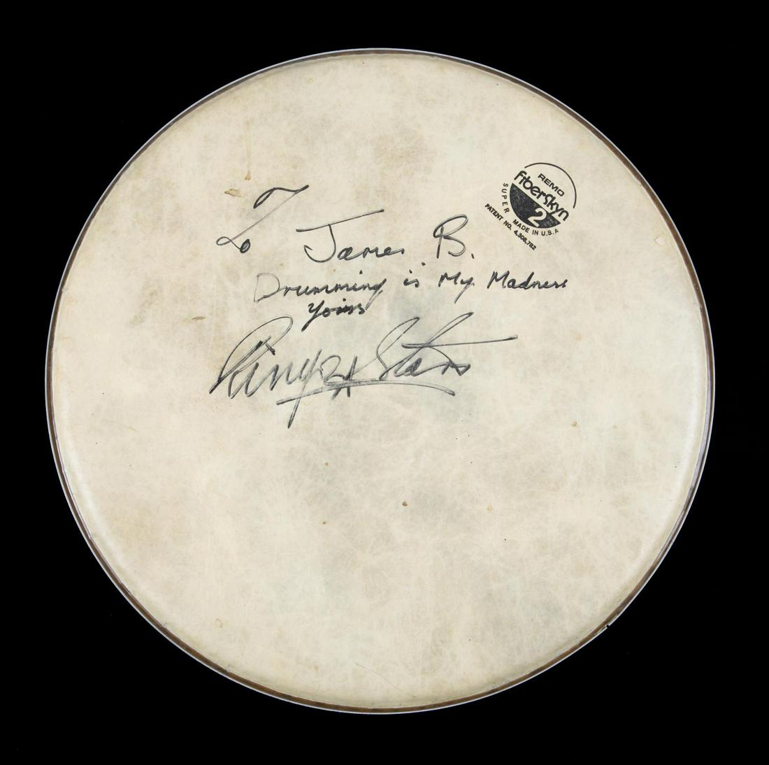 RINGO STARR SIGNED AND INSCRIBED DRUMHEAD: A Remo Fiberskyn drumhead signed in black marker “To James B. Drumming is my madness. Yours Ringo Starr.” Diameter, 13 1/2 inches Rock 'N' Roll