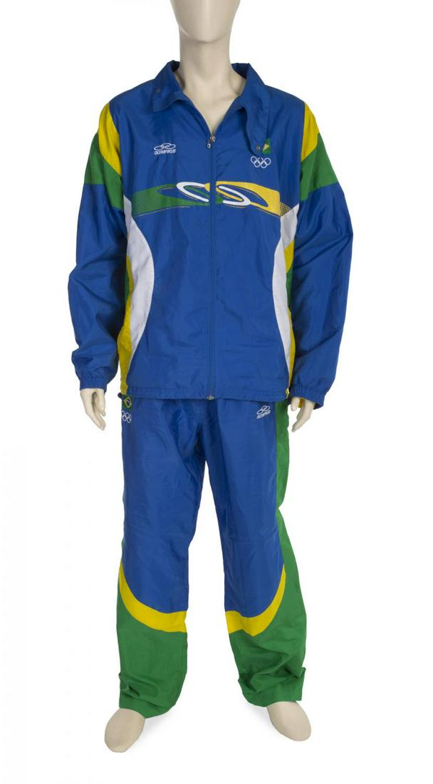 2004 OLYMPIC GAMES BRAZIL TRACKSUIT: An official 2004 Athens Summer Olympics Athletes men’s outfit worn by a member of the Brazil national football team. Olympikus Brand, size L. Sports