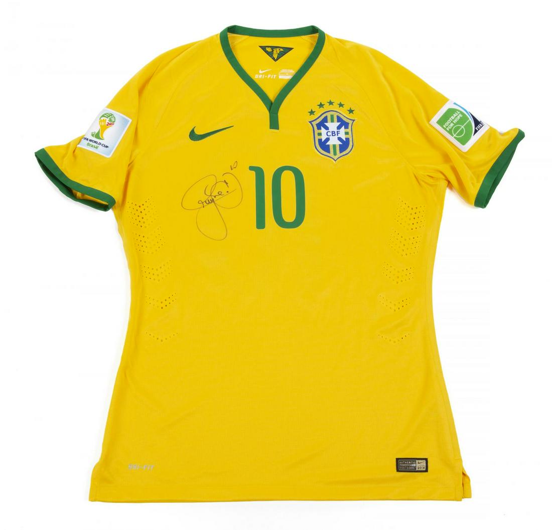 NEYMAR 2014 WORLD CUP SIGNED AND MATCH WORN JERSEY: A jersey worn and signed by Neymar for Brazil during the 2014 World Cup. Accompanied by a signed certificate of authenticity from former technical coordinator Marcos Teixeira. Sports